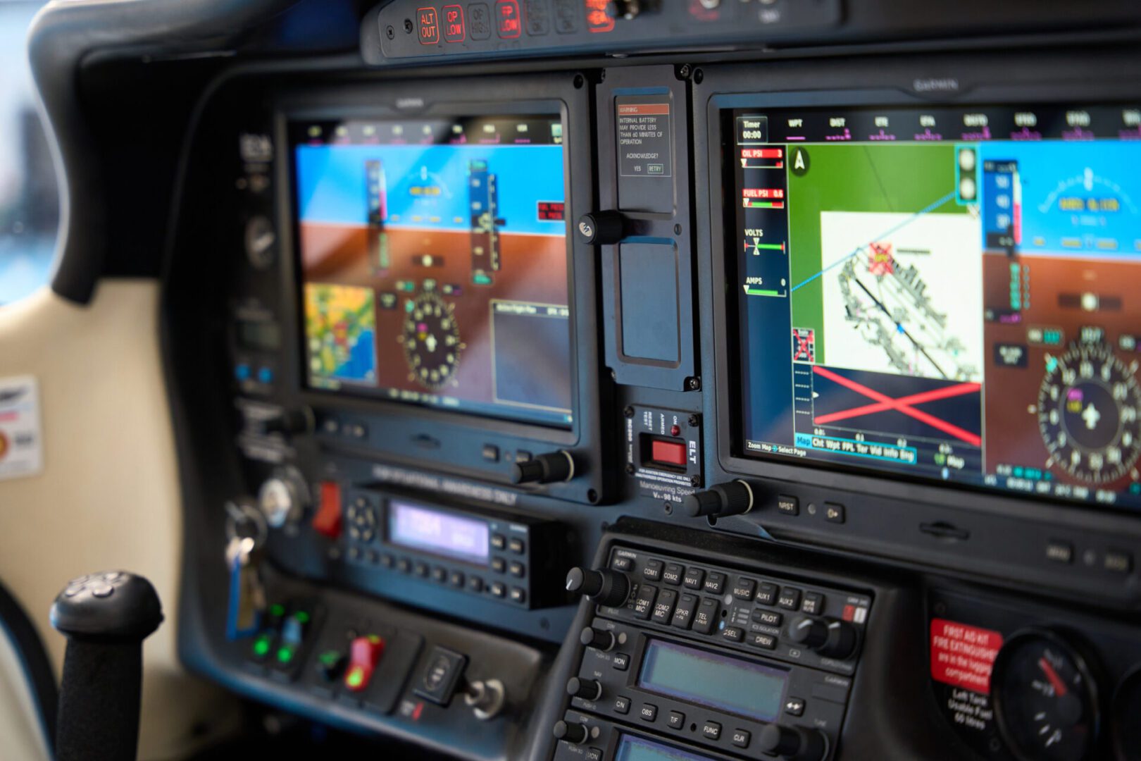 Aircraft cockpit with digital flight instruments.