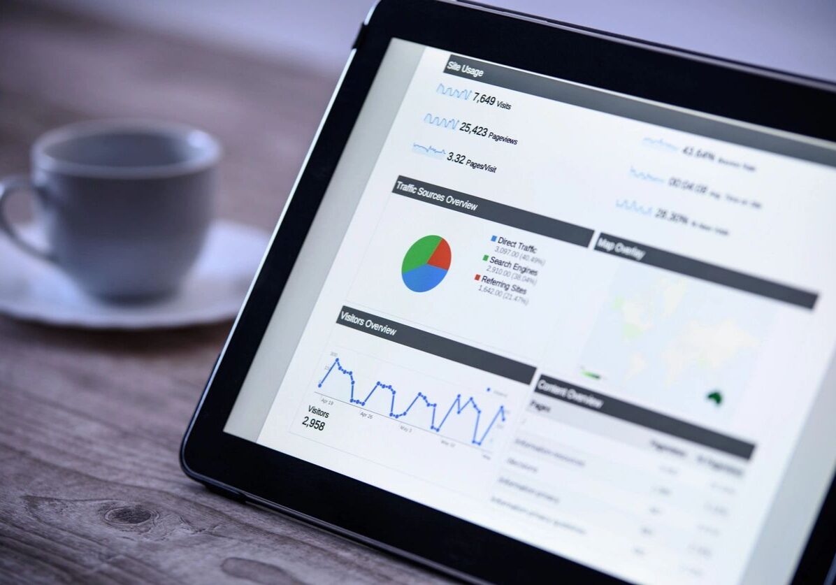 Tablet displaying analytics data and graphs.